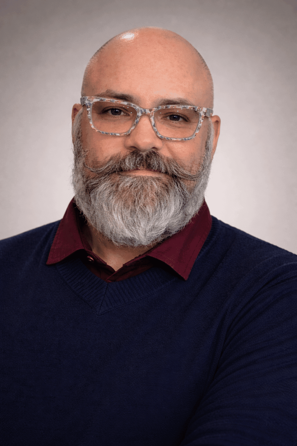 Man with beard in sweater.